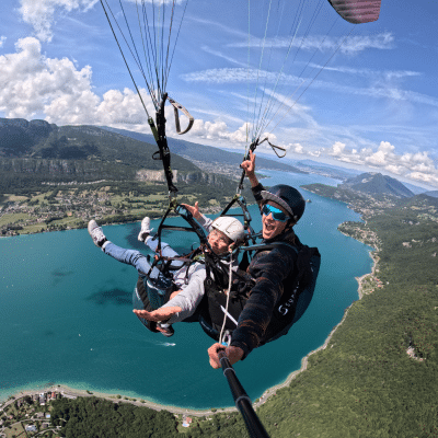 Paragliding over a mountain lake